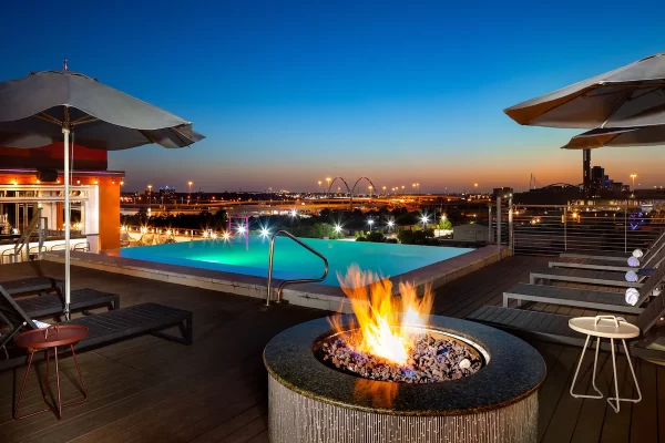 Canvas Hotel Dallas Rooftop pool and sun loungers